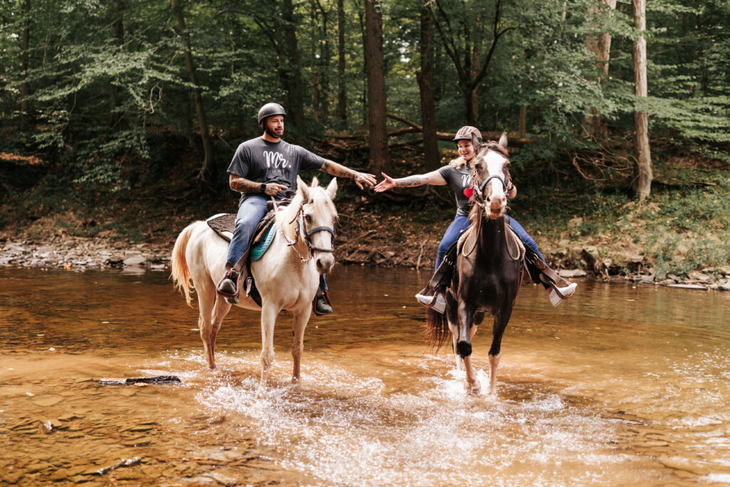 Brida and groom Horseback riding after their wedding ceremony as their elopement day activity by EZ Elopements