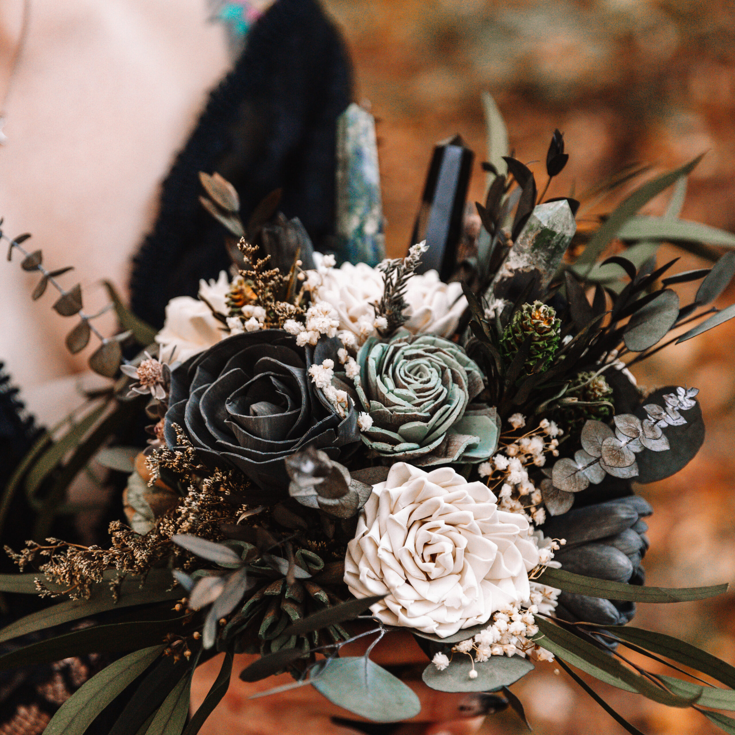 Beautiful statement bouquet with bold dark green, white and sage elements as well as three large crystal spires embedded. 