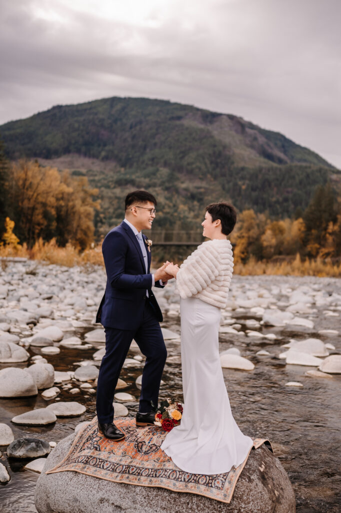 Couple eloping in a river in the Pacific North West. 